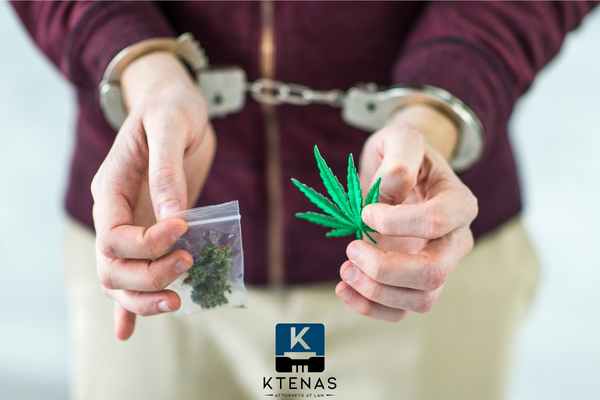 a man under arrest for possession of cannabis